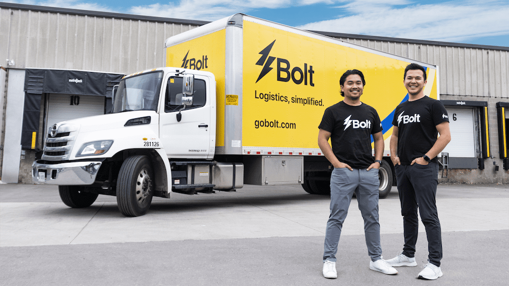 GoBolt's co-founders in front of a yellow and white Bolt delivery truck