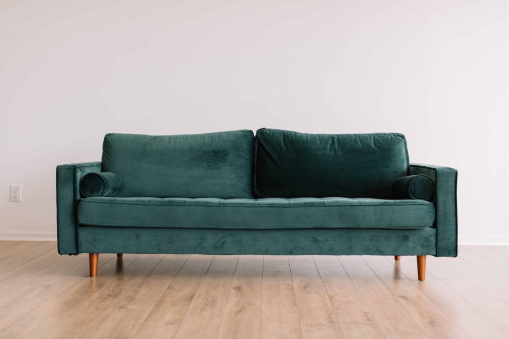 A green velvet sofa