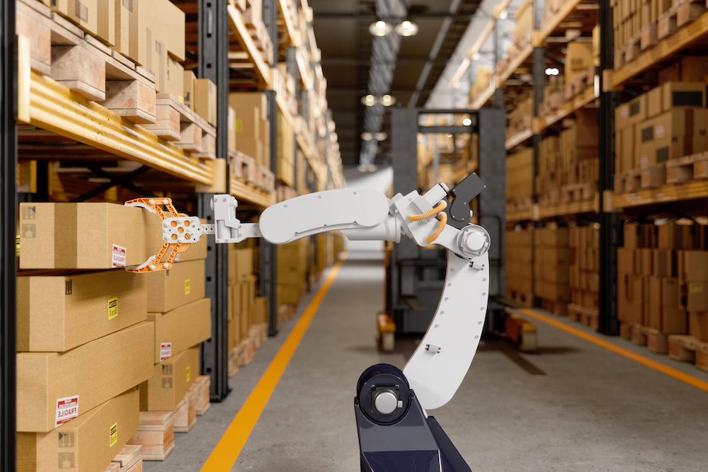 Image of a robot in a warehouse pulling a package from a shelf
