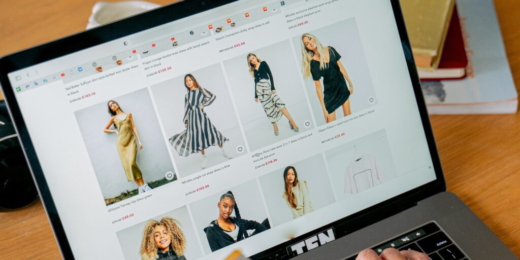 Shopping Cart Conversion blog header - an image of a laptop screen showing someone online shopping