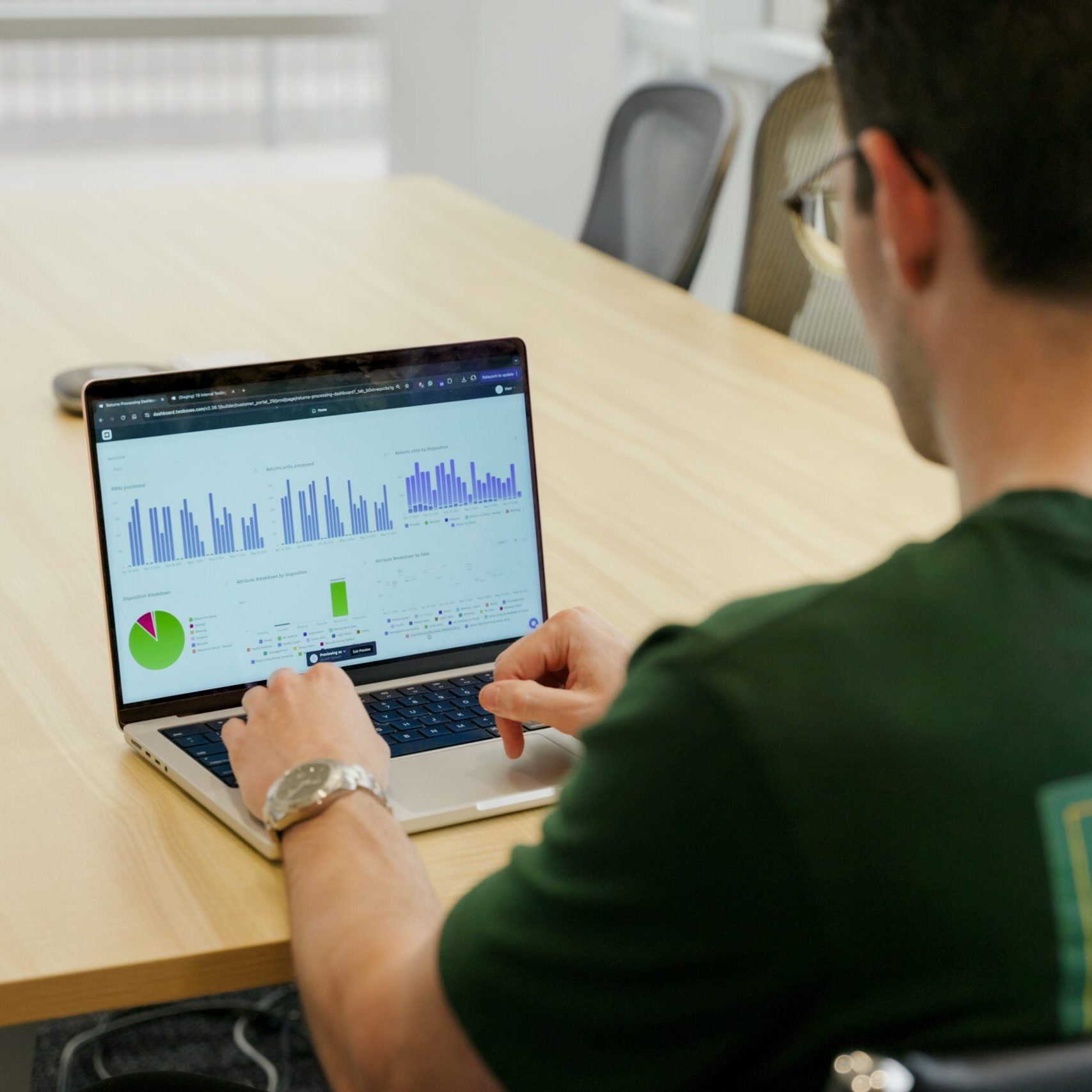 Person analyzing data on laptop.