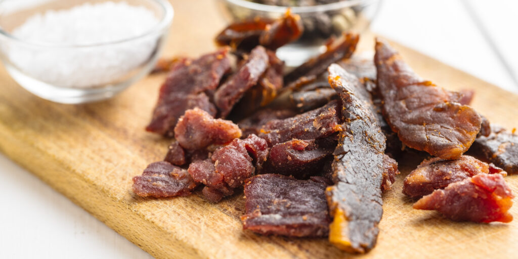 beef jerky on a wooden board, one of GoBolt Parcel's shipping merchants